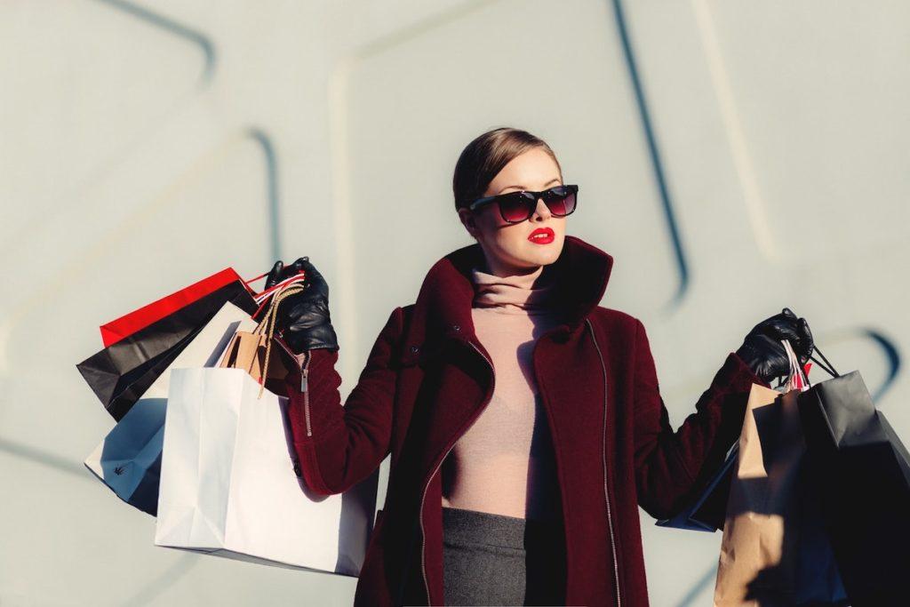 Woman In Red Coat Luxury Holiday Shopping